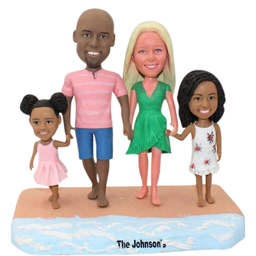 Custom family bobbleheads on beach from photo