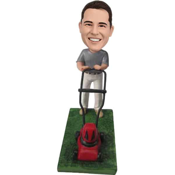 Bobblehead doll with mower landscaper mowing grass cutting