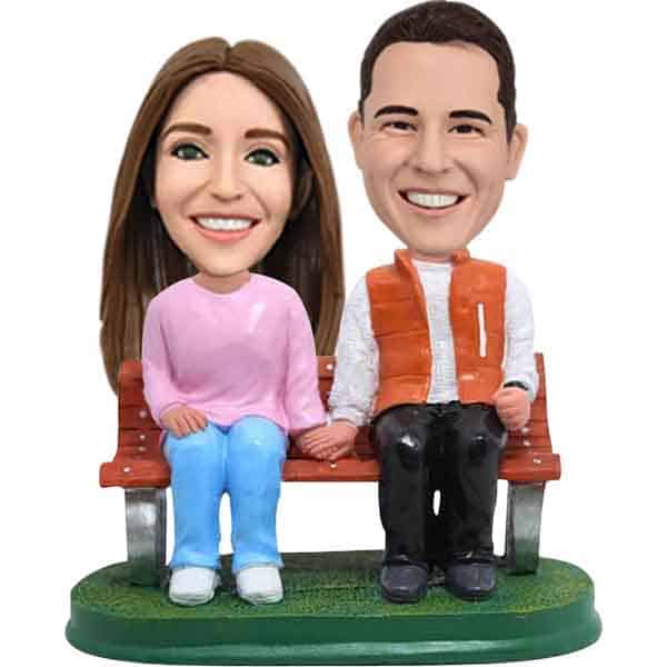 Custom bobbleheads sitting couple