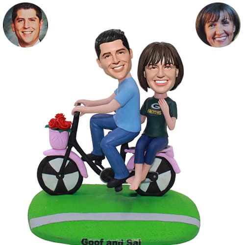 Customized couple bobbleheads on bike