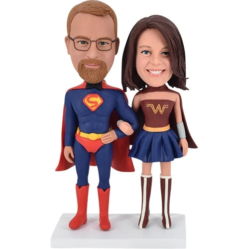 Superman and wonder woman bobbleheads