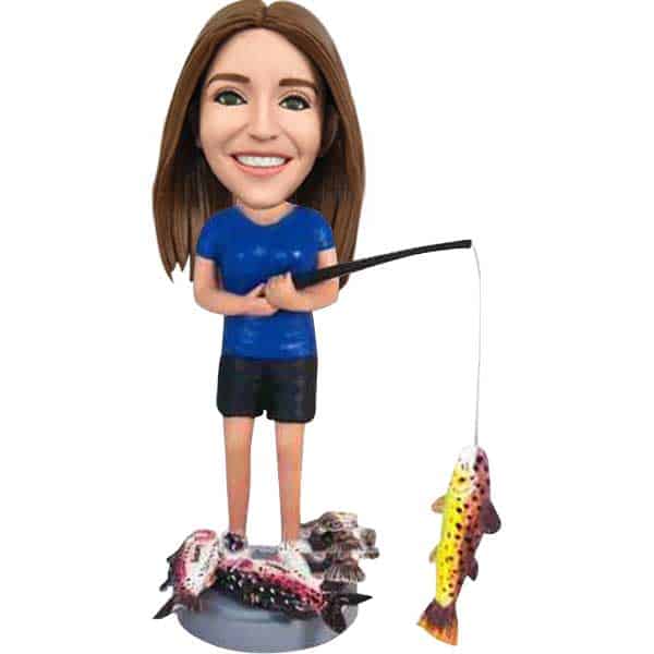 Bobblehead doll fishing woman