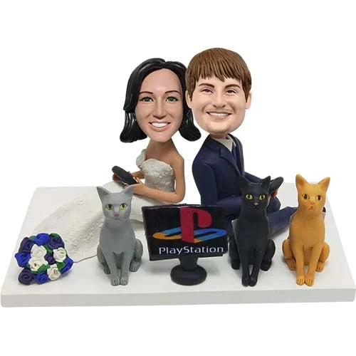 Custom wedding bobbleheads playing Playstation games