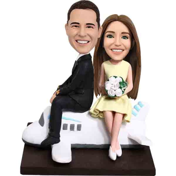 Personalized Wedding bobbleheads on airplane