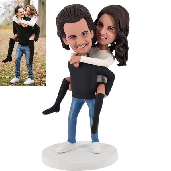 Couple Bobble Head Man carrying woman piggyback