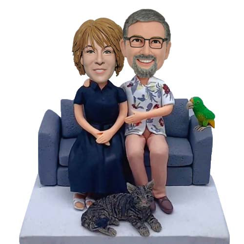 Custom parents bobbleheads on sofa with bird and cat