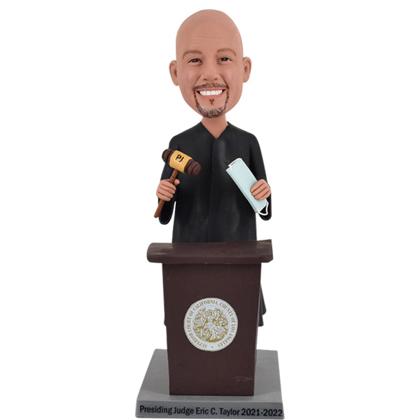 Custom Presiding Judge Bobblehead in front of podium