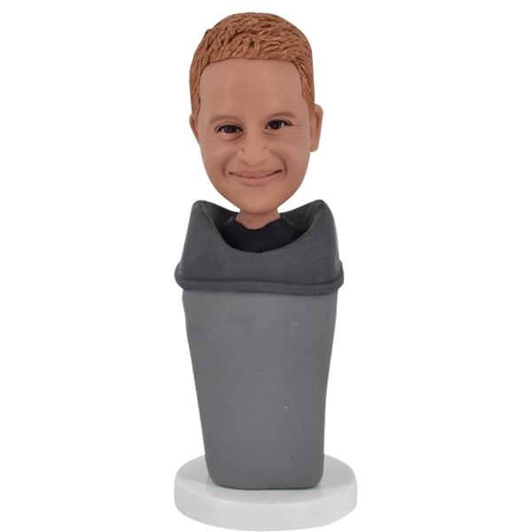 Bobblehead with goofy real face in bin