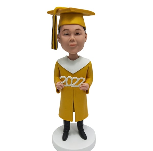 Graduation Bobblehead in golden gown 2024