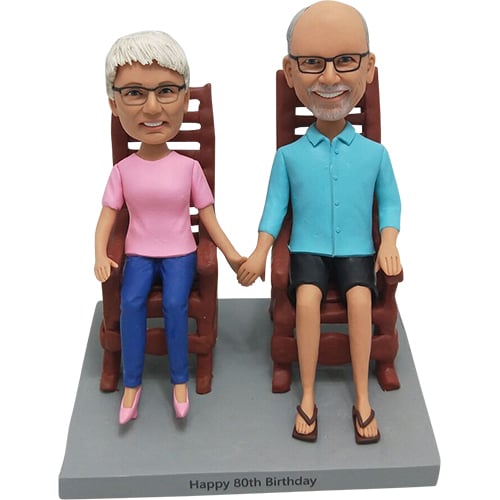 Couple bobbleheads in Chair
