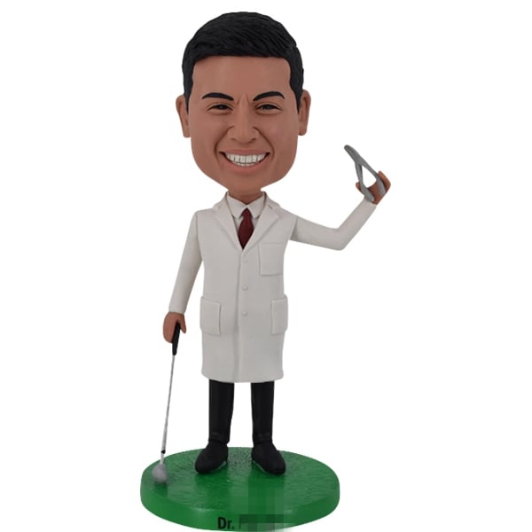 Dentist Bobblehead Doll holding dental pilers and golf club