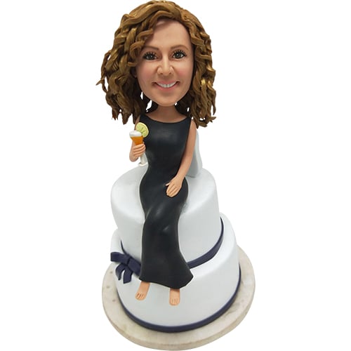 Birthday Bobbleheads custom sitting on cake