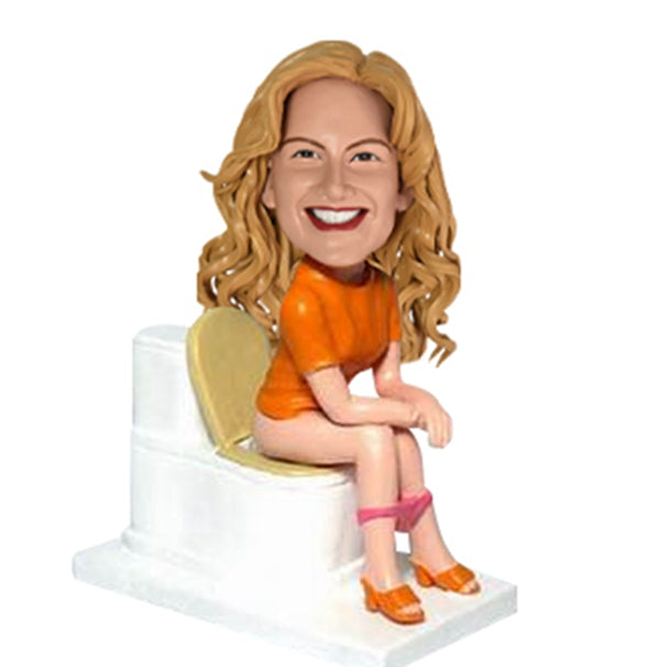 Female Bobble Head On Toilet